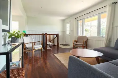 a living room with a couch and a table at Grays Lane - Minutes to Sandbanks in Bloomfield