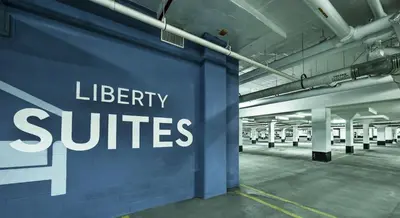 a blue wall with the words library suites on it at Liberty Suites in Thornhill
