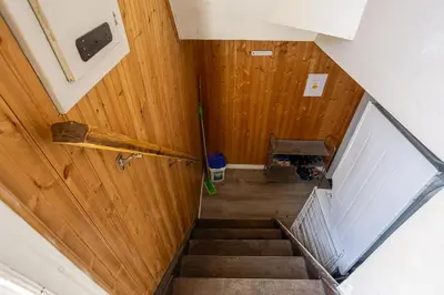 an overhead view of a staircase with wood paneling at Private room with TVnetflix and free parking in Pickering