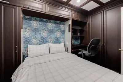 a bedroom with a bed and a desk and a chair at Prime Location 2BR with KingBed in Vibrant Toronto in Toronto