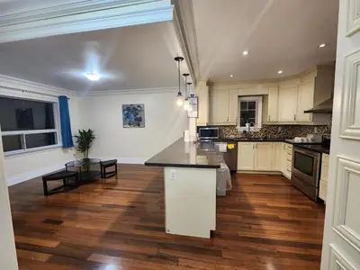 a kitchen with a island in the middle of a room at Toronto Uptown 1 - Bus to Downtown in Toronto