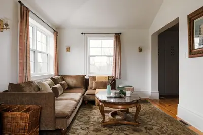 a living room with a couch and a table at Little Louis - A Princely Take on a County Getaway in Mountain View