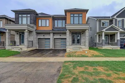 a large house with a driveway in front of it at Modern NEW Build in Caledonia in Caledonia