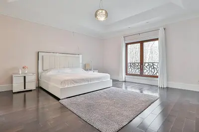 a white bedroom with a bed and a window at Luxurious Spa Retreat - Toronto Escape in Toronto