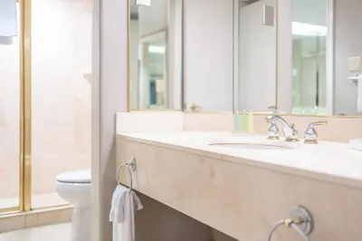 a bathroom with two sinks and a toilet at Horseshoe Valley Suites - The Azure in Shanty Bay