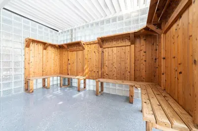 a room with wooden walls and benches in it at Horseshoe Valley Suites - The Azure in Shanty Bay