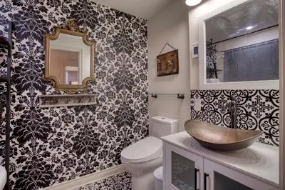 a bathroom with a sink and a toilet and a mirror at Rustic Elegant Stays in Niagara Benchlands in Beamsville