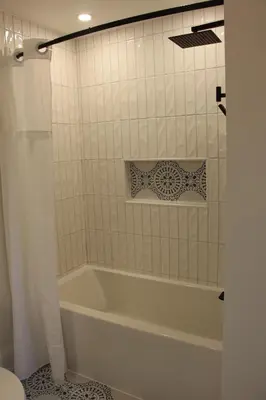 a white bath tub in a bathroom with a toilet at 4 Guest Suite with Waterfront Views at Fancie's PEC - Suite 2 in Belleville