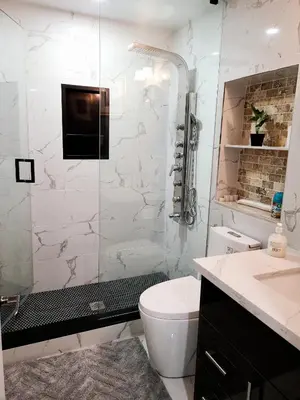 a bathroom with a shower and a toilet and a sink at LUXURY 2-BEDROOMS UNIT WITH WIFI, LDR & PARKING. in Cambridge