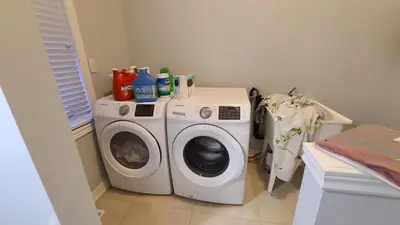a washer and dryer in a small room at LUXURY 2-BEDROOMS UNIT WITH WIFI, LDR & PARKING. in Cambridge
