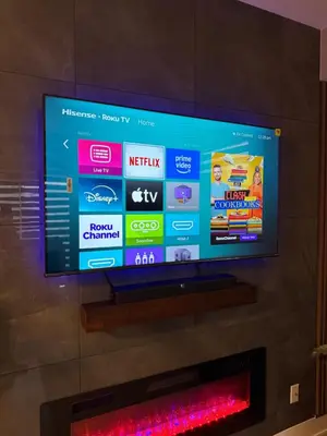 a flat screen tv sitting on top of a wall at Niagara Getaway across Fallsview in Niagara Falls