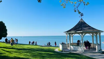 people standing around a gazebo on the beach at Barkerhouse 2# unit-heart of oldtown in Niagara on the Lake