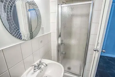 a bathroom with a sink and a shower at Stylish 4BR Home 20 Mins from YYZ in Mississauga