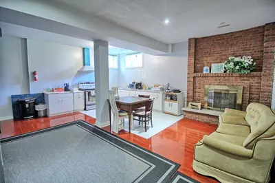 a kitchen and living room with a table and chairs at Bright Basement & Private Bathroom, free Parking in Vaughan