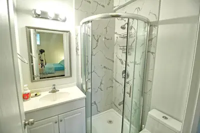 a bathroom with a shower and a sink at Bright Basement & Private Bathroom, free Parking in Vaughan