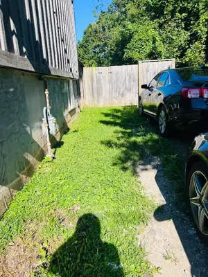 a shadow of a car parked next to a fence at LaVida Exclusive Guest House, Free Parking (Rm#2) in London