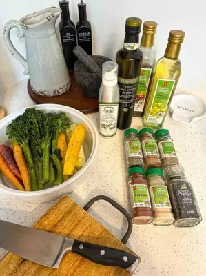 a counter with a bowl of vegetables and a knife at Waterfront Haliburton, All Season, Fully Equipped Cottage! in Haliburton