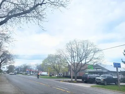 a person riding a bike down a street at Cozy Home in Niagara-on-the-Lake in Niagara on the Lake