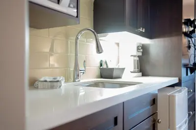 a kitchen with a sink and a counter top at Horseshoe Valley Suites - The Maple in Shanty Bay