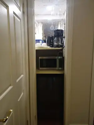 a kitchen with a stove and a microwave in a room at Waterfront Hideaway Private Suite-King bed room in Tottenham