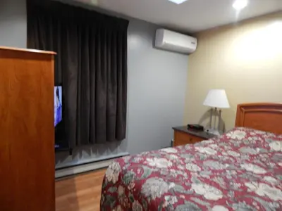 a hotel room with a bed and a window at Nox Hostel in Toronto