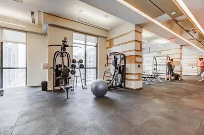a gym with treadmills and weights in a building at CN lovers in Toronto