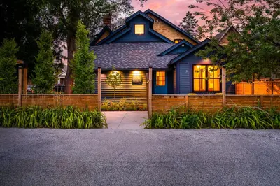 a blue house with its lights on at Somewhere Inn Collingwood in Collingwood