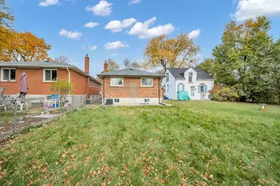 an empty yard in front of a house at Luxury Renovated House in Prime Location with Parking in Toronto