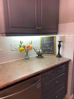 a kitchen counter with flowers and a sign on it at Bright & Cozy 4BR Home for Your Family Stay With Optional Pool Access in Mississauga