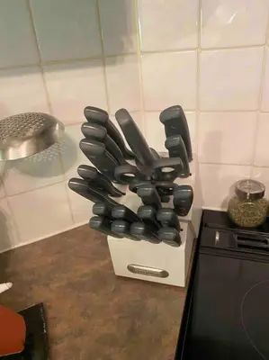 a knife block sitting on top of a kitchen counter at Bright & Cozy 4BR Home for Your Family Stay With Optional Pool Access in Mississauga