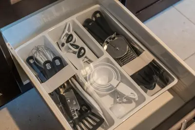 a drawer with scissors and other utensils in it at 6min To Niagara Falls - 4 Free Parking - Foosball in Niagara Falls