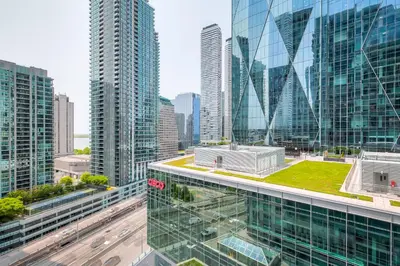 a view of a city skyline with tall buildings at RivetStays - The Yonge in Toronto