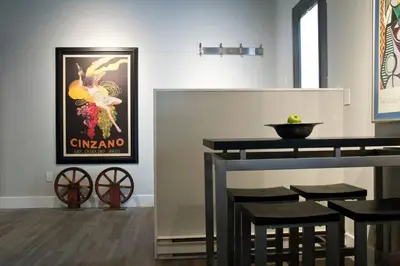 a dining room with a table and a movie poster at Woodbine Warehouse Apartment in Toronto