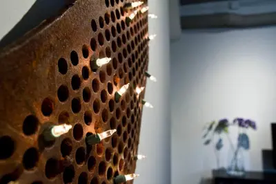 a metal wall with lights on it in a room at Woodbine Warehouse Apartment in Toronto