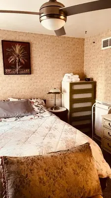 a bedroom with a large bed and a dresser at Comfortable Stay In Beautiful Home in Milton