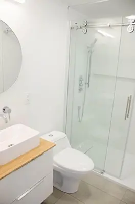 a bathroom with a shower and a toilet and a sink at Heaven on Huycks Bay in Hillier