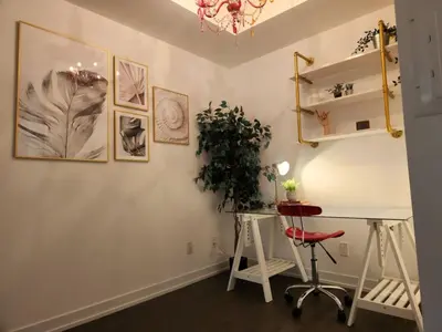 a room with a desk and a plant on a wall at Chic 1BDR Loft with Office Space-Heart of Toronto in Toronto