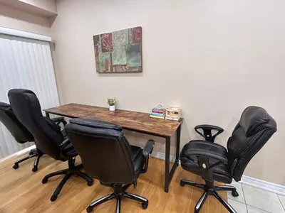 a room with a table and four chairs at Avid vacation palace in Castlemore , Brampton in Brampton