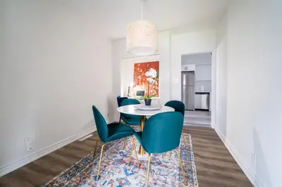 a dining room with a table and chairs at 2br - Spacious Yard - Canal Bridge, Falls Nearby! in Welland