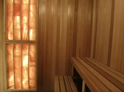 a sauna with wooden walls and a wooden bench at Presidential Suite Heart of Downtown with Stunning View in Toronto