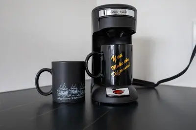 two coffee mugs are sitting on a table at SHORE VISTA LODGE in Georgina
