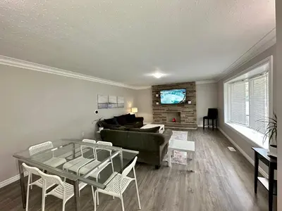a living room with a couch and a table at Mountain View Suite - Sleeps 6 in St. Catharines