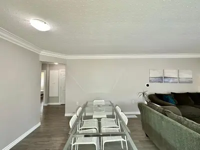 a living room with a couch and a table at Mountain View Suite - Sleeps 6 in St. Catharines