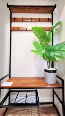 a potted plant sitting on a wooden table at The Serene Haven Modern 2 Queen Bed Full Apartment in St. Catharines