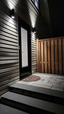 a front door of a building with a window at The Serene Haven Modern 2 Queen Bed Full Apartment in St. Catharines