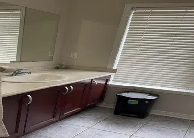 a bathroom with a sink and a mirror at Bright Queen Room close to Sheridan College and Airport in Brampton