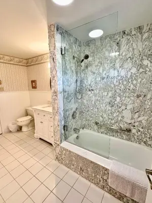 a bathroom with a tub and a shower and a toilet at Mountain Ash Country Manor and Spa in Creemore