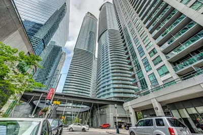 a group of tall buildings in a city at Skyline Retreat Residences in Toronto