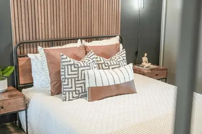 a bedroom with a bed with pillows on it at Skyline Retreat Residences in Toronto