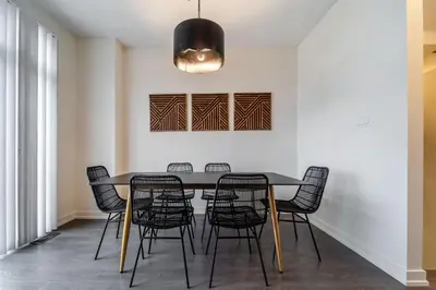 a dining room with a table and chairs at Luxury Urban Town home in Oakville